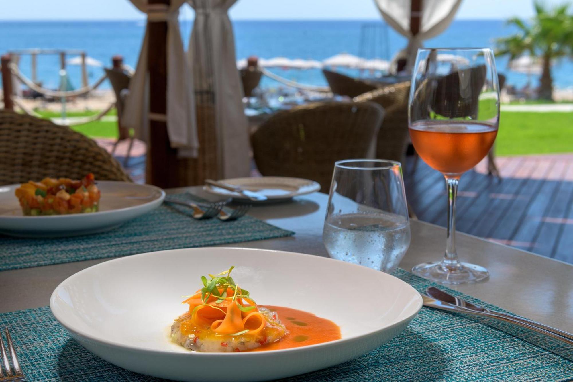 Rodos Palladium Leisure & Wellness Mourátagas Exterior photo A glass of rosé wine